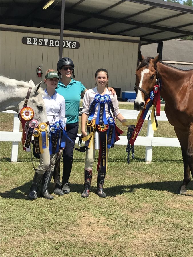 Amazing Grace Equestrian students competing at horse show in Florida.